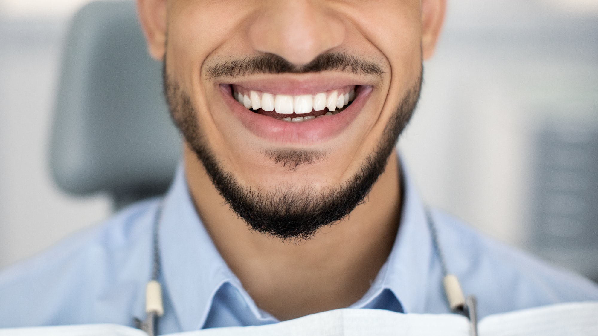 Dental Treatment Result. Happy Young Arab Man Smiling With Perfect Teeth, Closeup