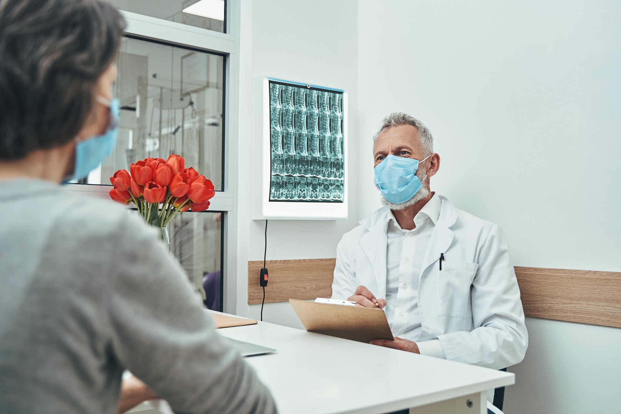 Experienced male doctor conducting an initial consultation