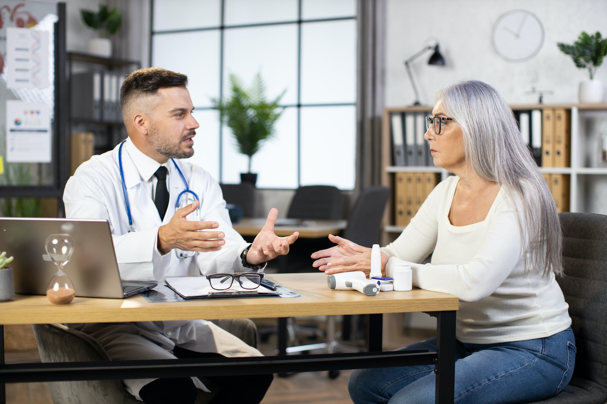 Mature woman having appointment at general practitioner doctor