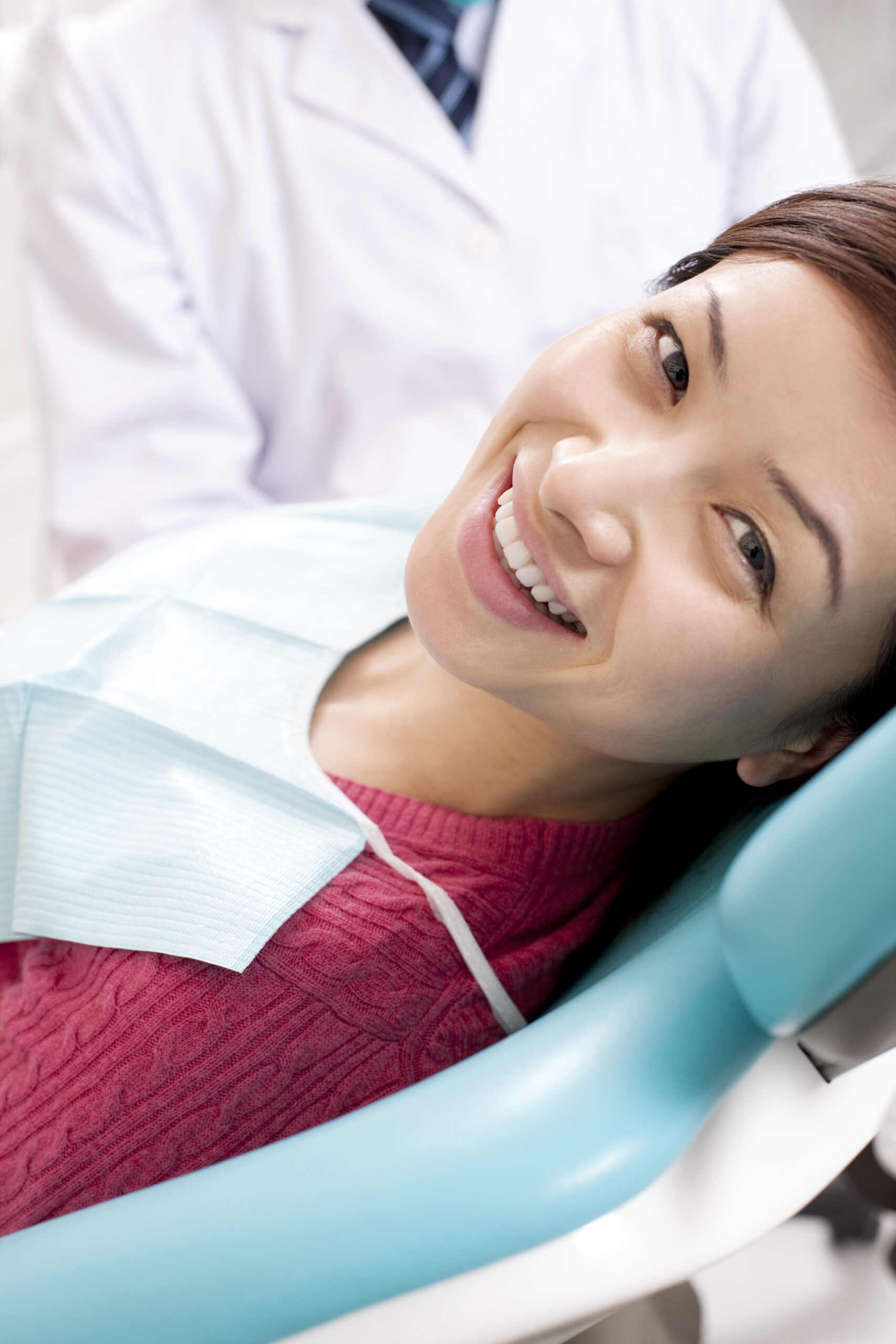 Chinese patient receiving treatment in dental clinic