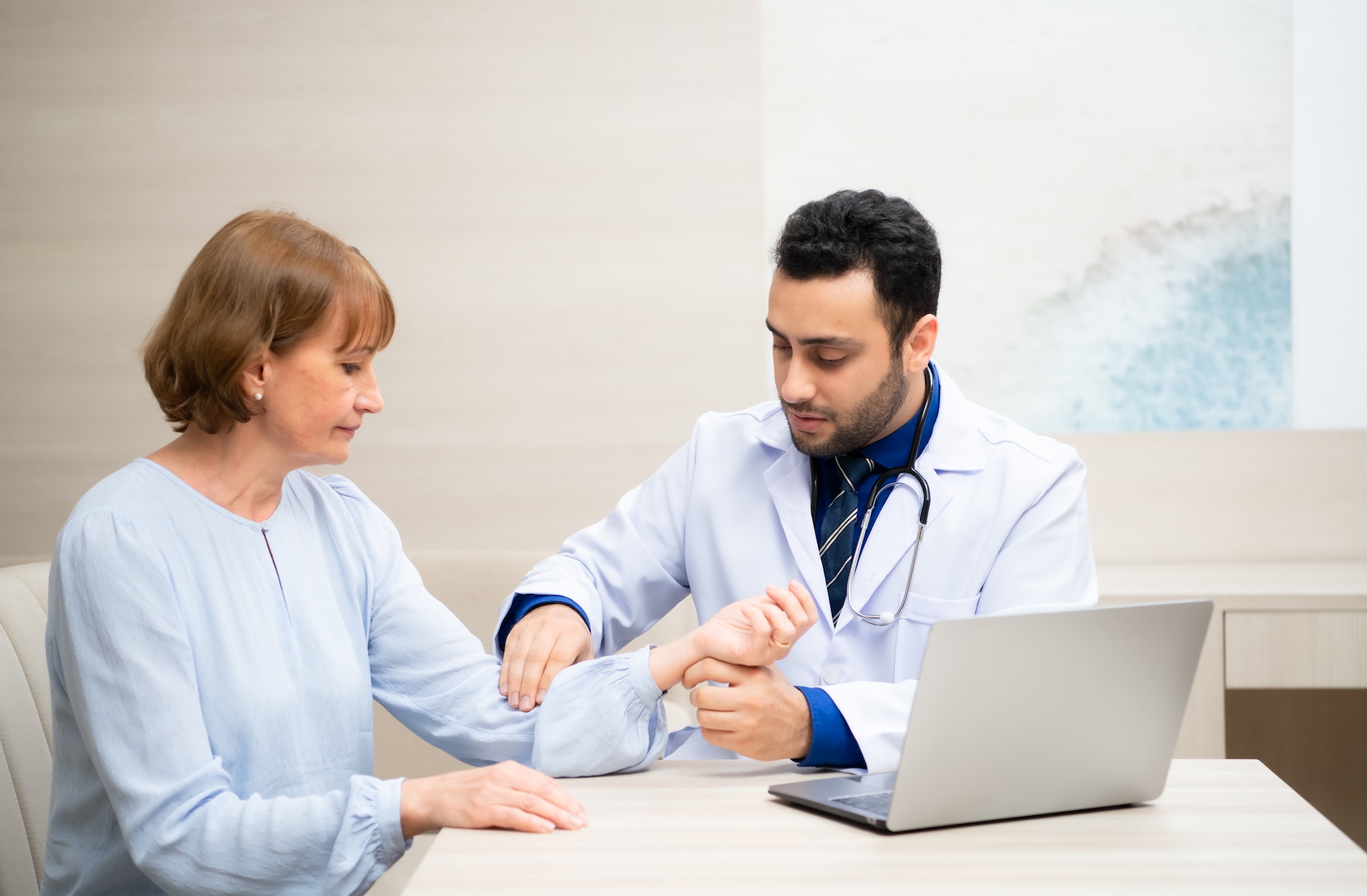 Woman entering old age, Attend an annual health and check-up and discussion with doctor in hospital